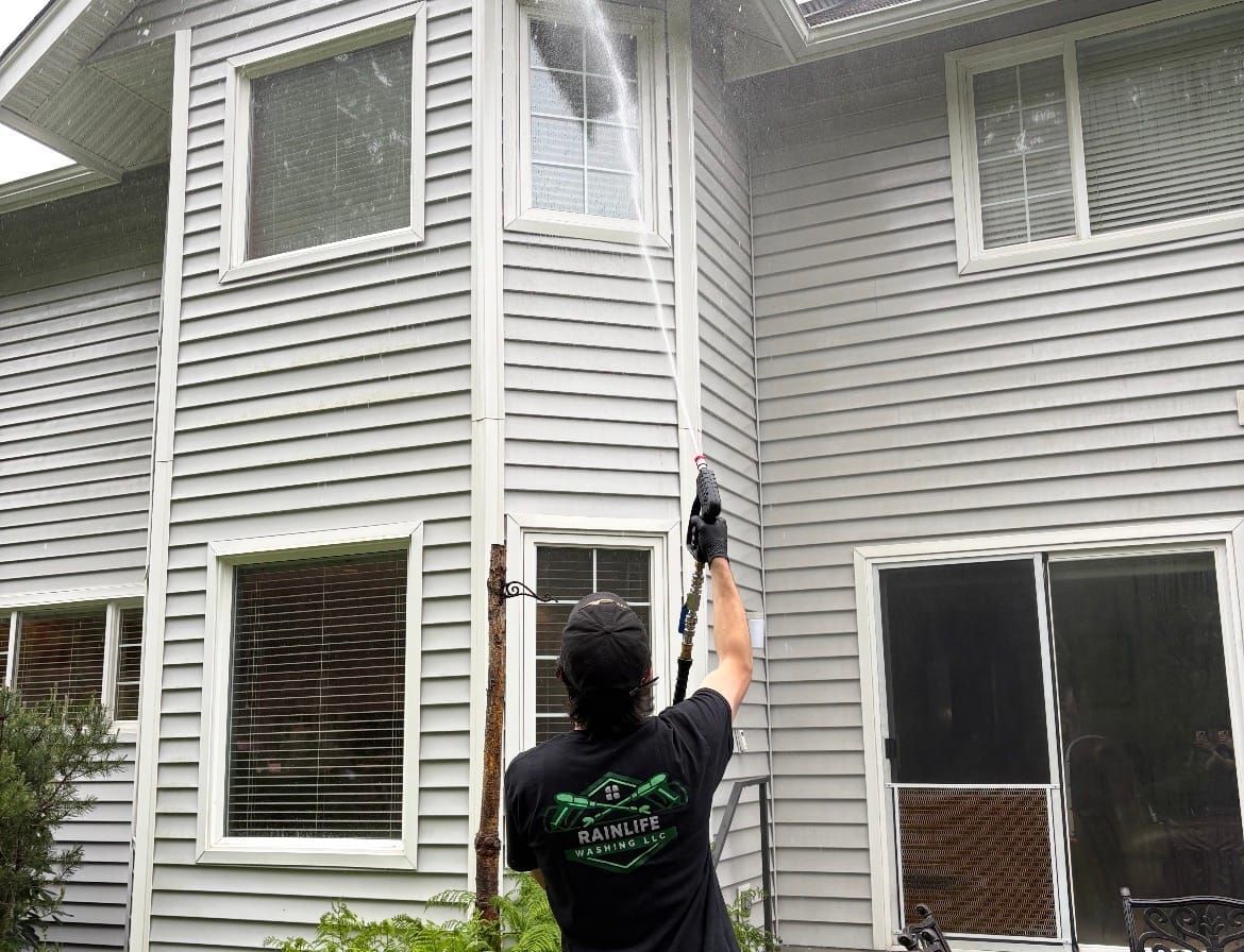 Rainlife Washing technician soft washing siding